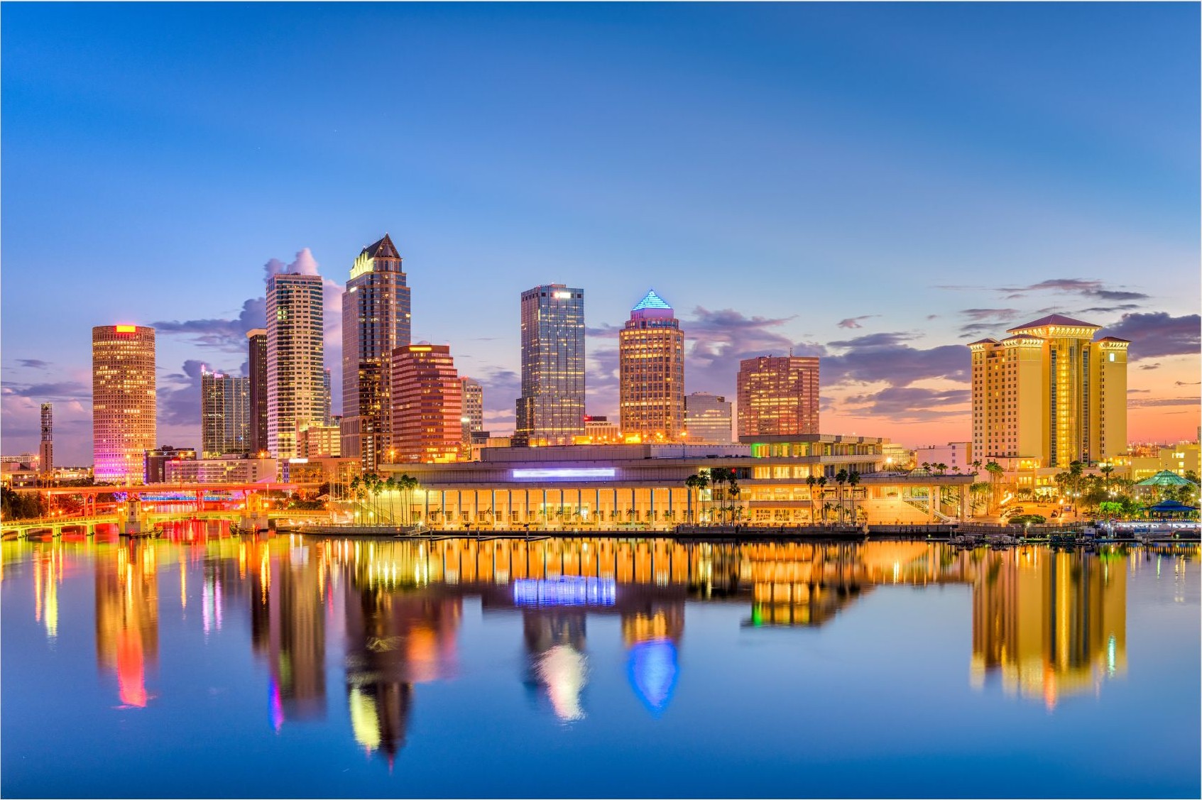 Downtown Tampa at dusk, reflected in Hillsborough Bay &mdash; Polk-Neal & Associates serves specialty practices across Hillsborough County.